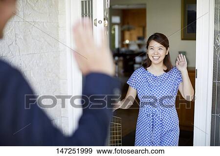 Stock Photo - Happy Japanese woman at home. Fotosearch