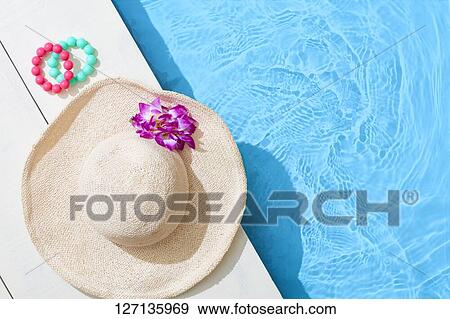 Hat At The Poolside View Large Photo Image Stock Photo - Hat At The Poolside. Fotosearch