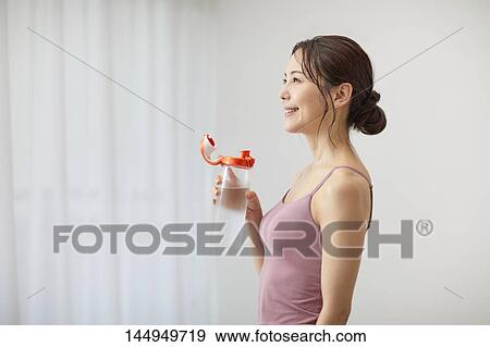 Healthy Japanese woman training at home View Large Photo Image Stock Photo - Healthy Japanese woman training at home. Fotosearch