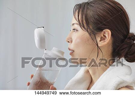Healthy Japanese woman training at home View Large Photo Image Stock Photo - Healthy Japanese woman training at home. Fotosearch