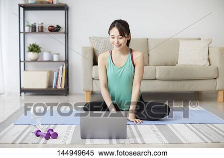 Healthy Japanese woman training at home View Large Photo Image Stock Photography - Healthy Japanese woman training at home. Fotosearch
