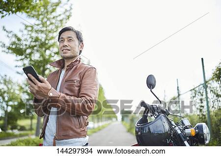 Picture - Japanese biker. Fotosearch