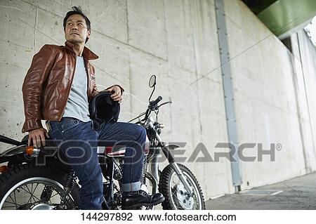Stock Image - Japanese biker. Fotosearch