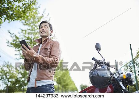 Stock Image - Japanese biker. Fotosearch