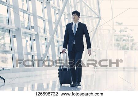 Japanese businessman at the airport View Large Photo Image Stock Image - Japanese businessman at the airport. Fotosearch