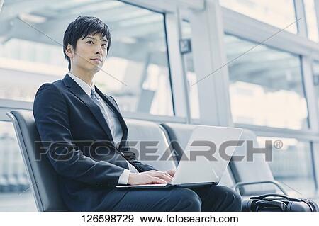 Japanese businessman at the airport View Large Photo Image Stock Photo - Japanese businessman at the airport. Fotosearch