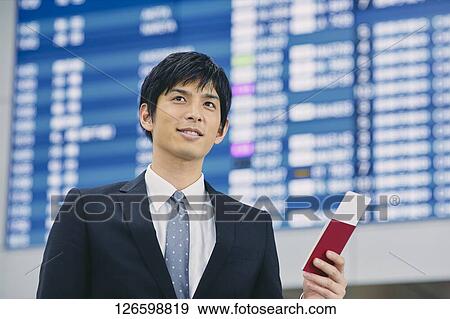 Stock Photo - Japanese businessman at the airport. Fotosearch