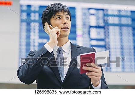 Stock Photography - Japanese businessman at the airport. Fotosearch
