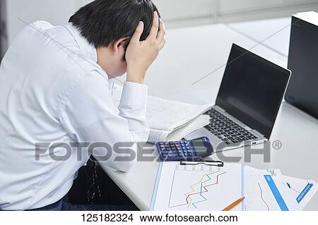 Picture - Japanese businessman in the office. Fotosearch