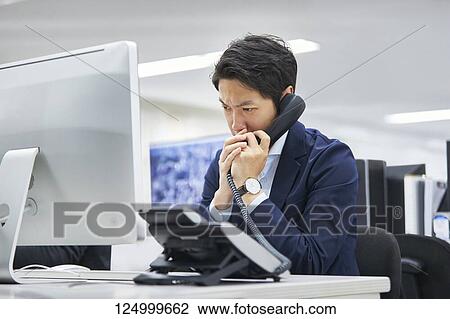 Stock Image - Japanese businessman in the office. Fotosearch