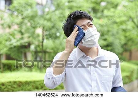 Japanese Businessman Wiping Off The Sweat With Handkerchief View Large Photo Image Picture - Japanese Businessman Wiping Off The Sweat With Handkerchief. Fotosearch