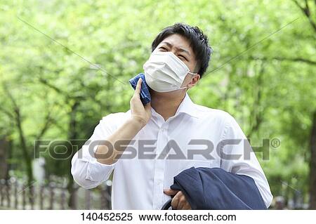 Japanese Businessman Wiping Off The Sweat With Handkerchief View Large Photo Image Stock Photography - Japanese Businessman Wiping Off The Sweat With Handkerchief. Fotosearch