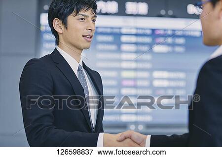 Japanese businessmen at the airport View Large Photo Image Stock Photo - Japanese businessmen at the airport. Fotosearch