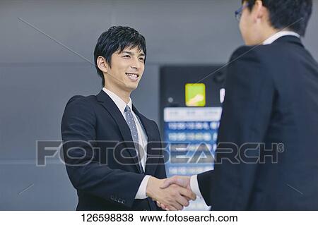 Japanese businessmen at the airport View Large Photo Image Stock Photo - Japanese businessmen at the airport. Fotosearch