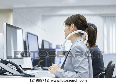 Stock Image - Japanese businesswoman in the office. Fotosearch