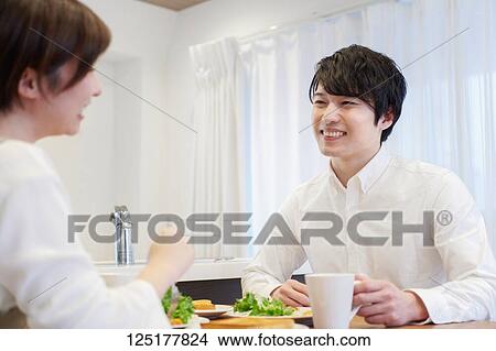 Picture - Japanese couple at home. Fotosearch