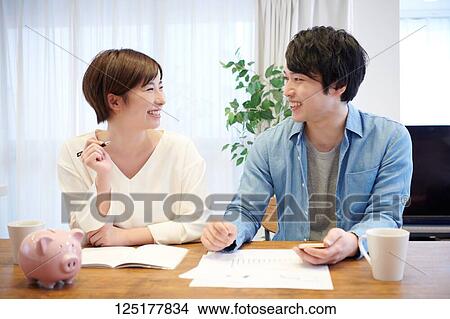 Picture - Japanese couple at home. Fotosearch