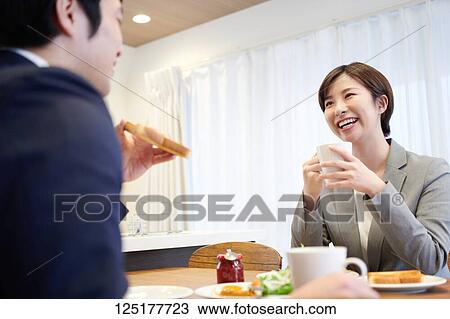 Stock Image - Japanese couple at home. Fotosearch