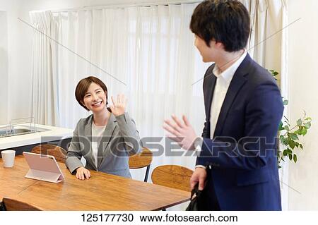 Stock Image - Japanese couple at home. Fotosearch