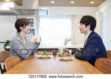 Stock Image - Japanese couple at home. Fotosearch
