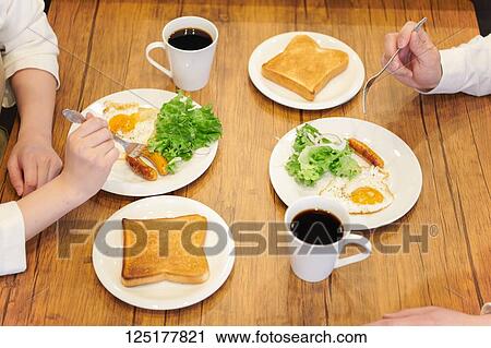 Stock Image - Japanese couple at home. Fotosearch