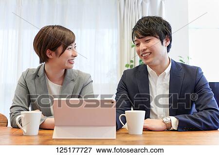 Stock Photo - Japanese couple at home. Fotosearch