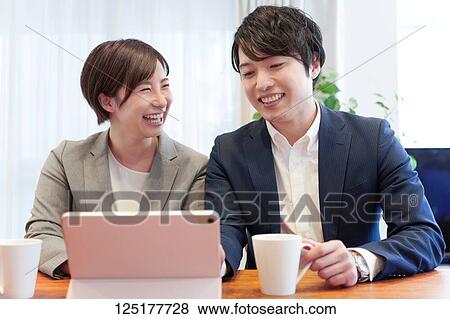 Stock Photo - Japanese couple at home. Fotosearch