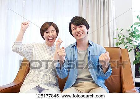 Stock Photography - Japanese couple at home. Fotosearch