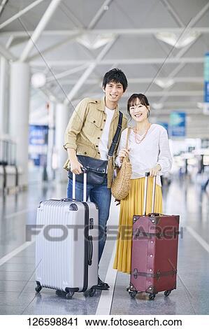 Japanese couple at the airport View Large Photo Image Stock Image - Japanese couple at the airport. Fotosearch