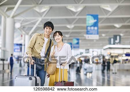 Japanese couple at the airport View Large Photo Image Stock Image - Japanese couple at the airport. Fotosearch
