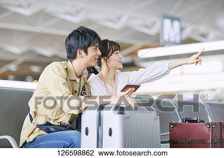 Japanese couple at the airport View Large Photo Image Stock Image - Japanese couple at the airport. Fotosearch