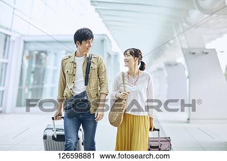 Japanese couple at the airport View Large Photo Image Stock Image - Japanese couple at the airport. Fotosearch