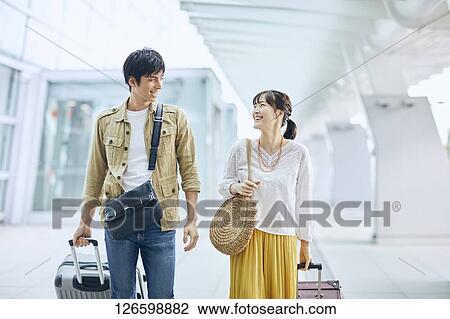 Japanese couple at the airport View Large Photo Image Stock Image - Japanese couple at the airport. Fotosearch