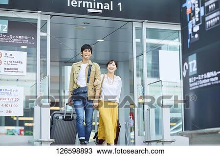Japanese couple at the airport View Large Photo Image Stock Image - Japanese couple at the airport. Fotosearch
