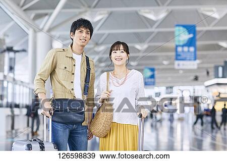 Japanese couple at the airport View Large Photo Image Stock Photo - Japanese couple at the airport. Fotosearch