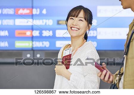 Stock Photo - Japanese couple at the airport. Fotosearch