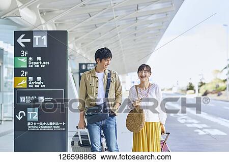 Japanese couple at the airport View Large Photo Image Stock Photo - Japanese couple at the airport. Fotosearch