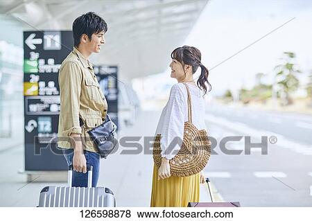 Japanese couple at the airport View Large Photo Image Stock Photo - Japanese couple at the airport. Fotosearch