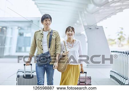 Japanese couple at the airport View Large Photo Image Stock Photo - Japanese couple at the airport. Fotosearch
