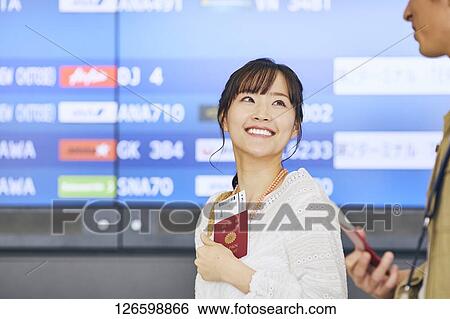Stock Photograph - Japanese couple at the airport. Fotosearch