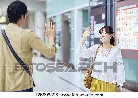 Japanese couple at the airport View Large Photo Image Stock Photograph - Japanese couple at the airport. Fotosearch