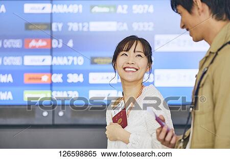 Japanese couple at the airport View Large Photo Image Stock Photography - Japanese couple at the airport. Fotosearch