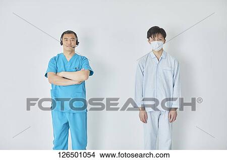 Picture - Japanese doctor and patient. Fotosearch