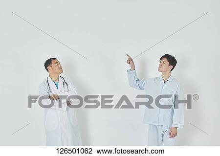 Japanese doctor and patient View Large Photo Image Stock Image - Japanese doctor and patient. Fotosearch