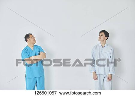 Japanese doctor and patient View Large Photo Image Stock Photo - Japanese doctor and patient. Fotosearch
