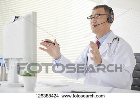 Japanese doctor in the studio View Large Photo Image Picture - Japanese doctor in the studio. Fotosearch