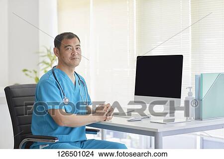 Picture - Japanese doctor in the studio. Fotosearch