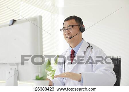 Japanese doctor in the studio View Large Photo Image Stock Image - Japanese doctor in the studio. Fotosearch