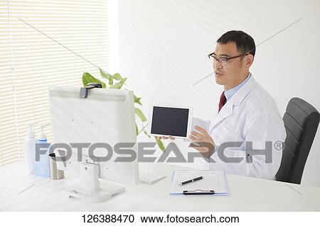 Japanese doctor in the studio View Large Photo Image Stock Image - Japanese doctor in the studio. Fotosearch