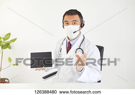 Japanese doctor in the studio View Large Photo Image Stock Image - Japanese doctor in the studio. Fotosearch